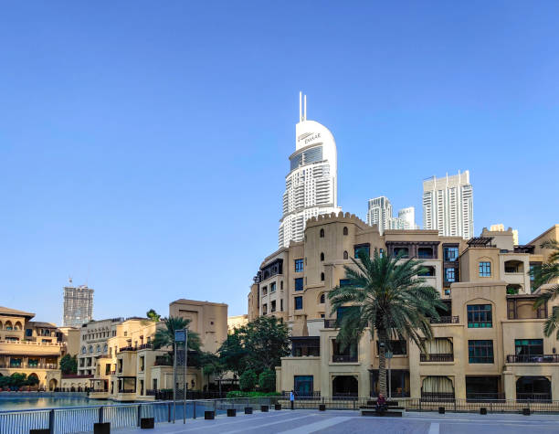 Investing in Dubai real estate: A person calculating down payment amount