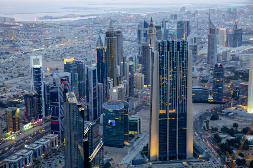 High-rise buildings and expansive cityscape of Dubai near Damac Hills 2 at dusk.