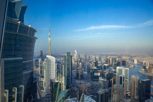 A panoramic view of Dubai's skyline from high-rise buildings, showcasing the city's urban development.